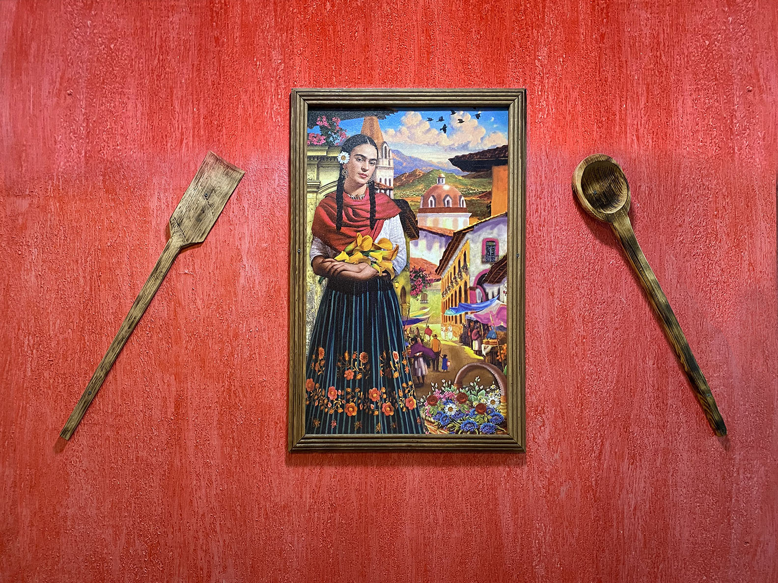 Mi Pueblito Cantina wal with painting of woman